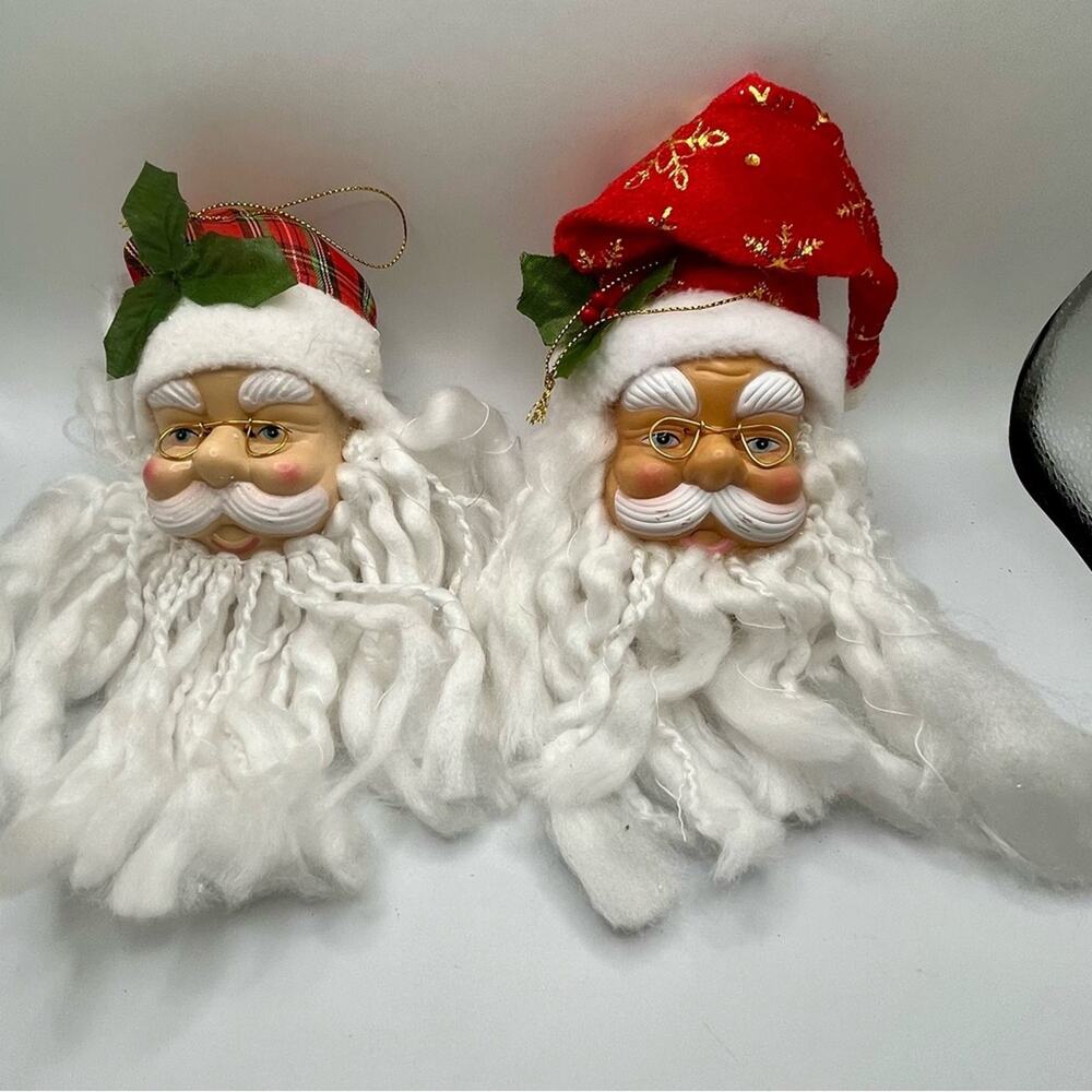 Two large Santa Christmas ornaments